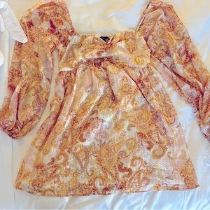 Lulu’s Radiant Suggestion Light Orange Paisley Babydoll Mini Dress.